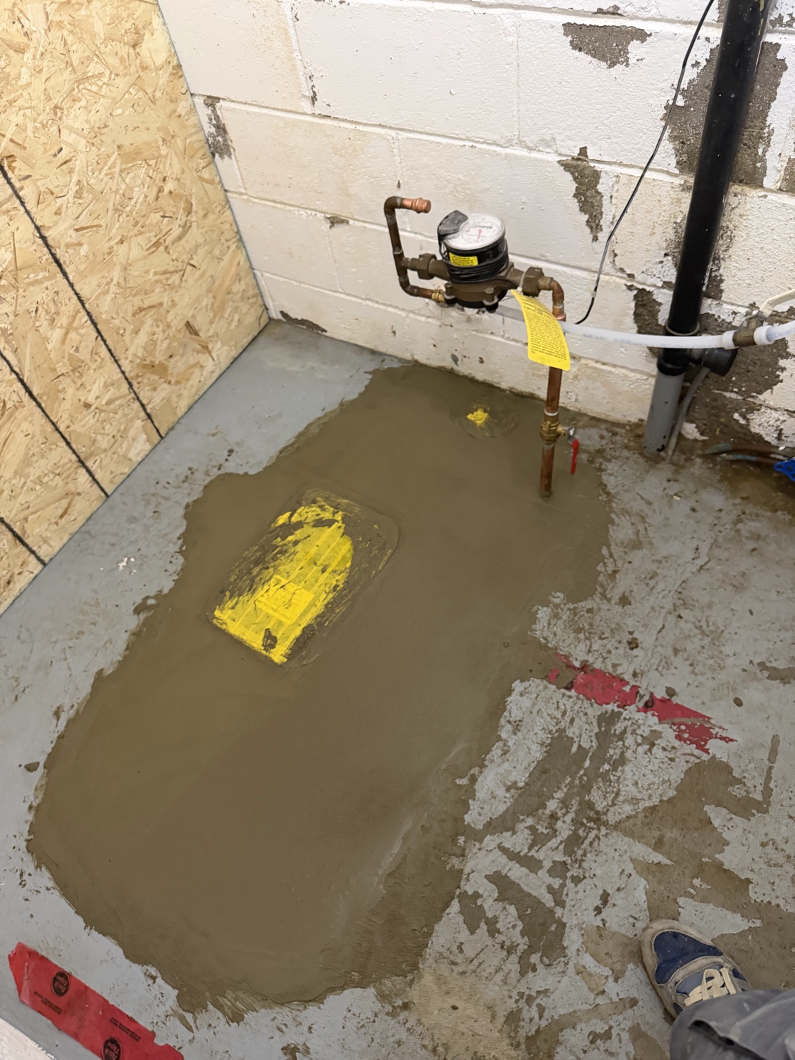 Concrete floor restored after backwater valve installation